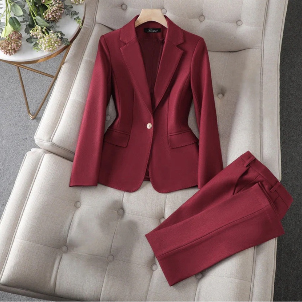 Never warn burgundy red women’s suit. Fits like medium